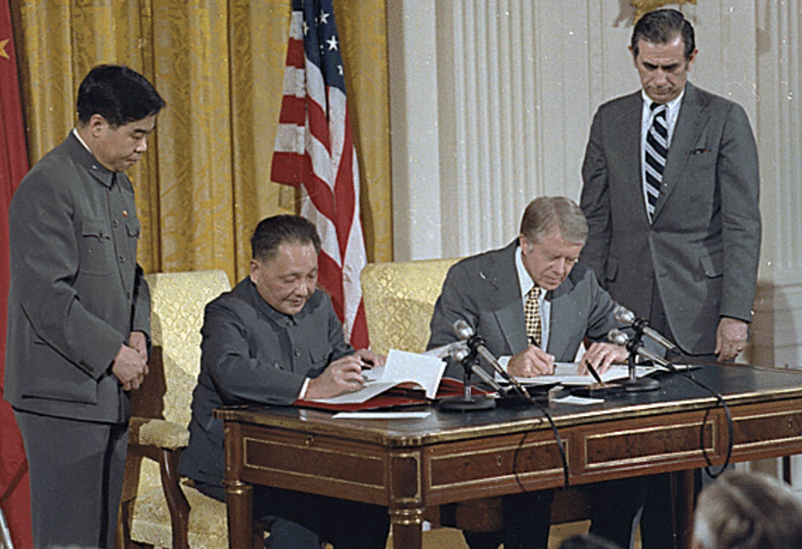 President Jimmy Carter and Chinese Vice Premier Deng Xiaoping sign diplomatic accords. 